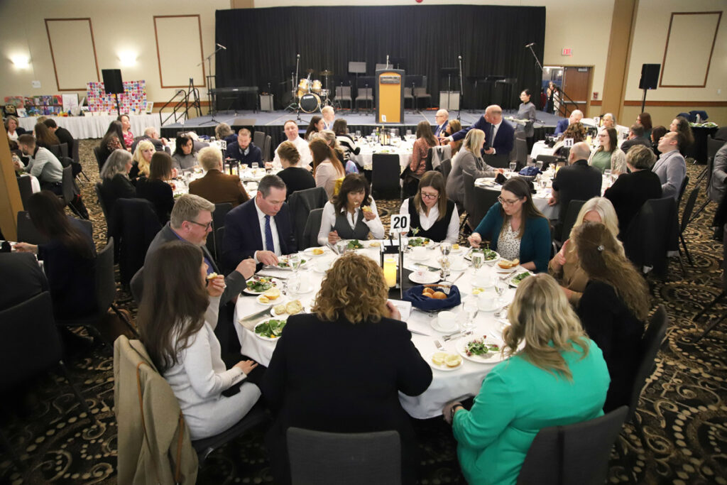 Wide shot of annual dinner gala.