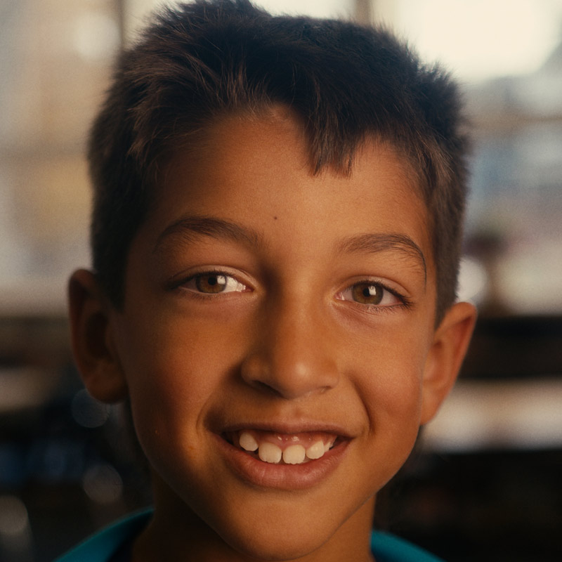 Young male student looking directly into camera.